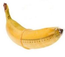 banana in a condom mimics an enlarged cock